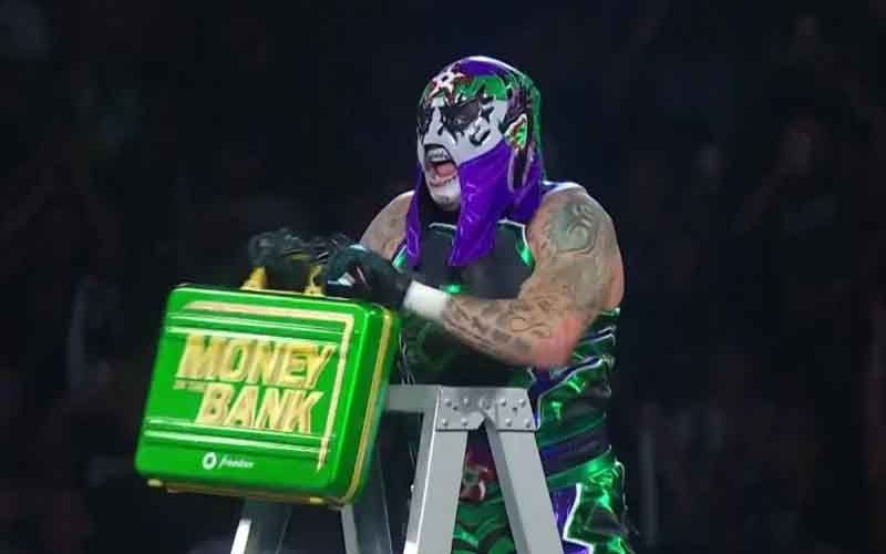 Penta claiming the Money In The Bank briefcase